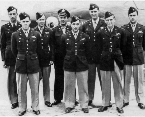 A group portrait featuring most of the American pilots who formed Watson's Whizzers photographed in Melun, France on June 27, 1945. They are standing beside Me 262A-1a/U3 after it had been re-christened "Lady Jess IV". Front row (l to r): Lt. William V. Haynes, Capt. Ken E. Dahlstrom, Lt. Robert C. Strobell. Rear row, (l to r): Lt. James K. Holt, Lt. Robert J. Anspach, Col. Harold N. Watson, Capt. Fred L. Hillis, Lt. Roy W. Brown, Jr.
